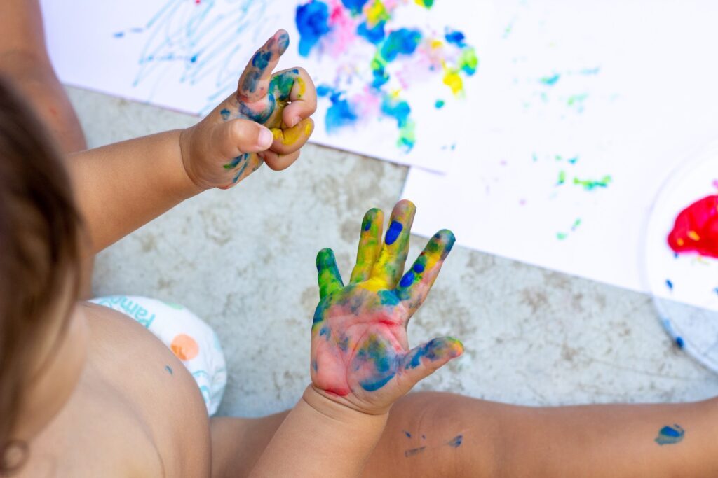 A kid with paint on his hands